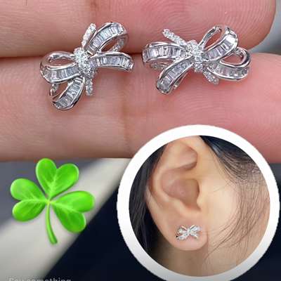 Natural white diamond bow earings in 18k gold