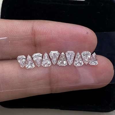  10 stunning natural shield-cut diamonds totaling 2.21 carats of brilliant sparkle.,FGH color and excellent VVS-VS clarity.