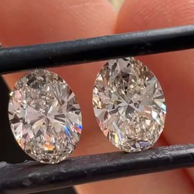 2.02ct Total Weight Matching Pair Of Natural LM Color Faint Brown VS Clarity Oval Shape Diamonds.
