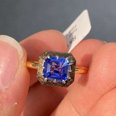 A GIA Certified 2.51ct Natural Ceylon Blue Sapphire Heated Emerald cut set in 18k Gold Ring.