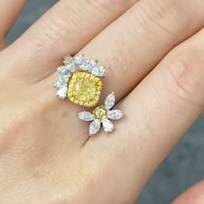 0.79ct Natural Fancy Yellow Cushion VS Clarity diamond, set in a luxurious 18k gold ring