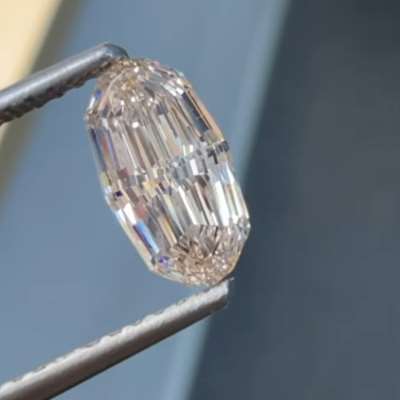 1.03ct GIA Certified Natural L Color Faint Brown VS2 Clarity Elongated Oval Shape Step Cut Diamond.