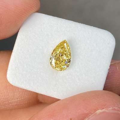 1.01ct GIA Certified Natural Fancy Yellow VS1 Clarity Pear Shape Diamond.