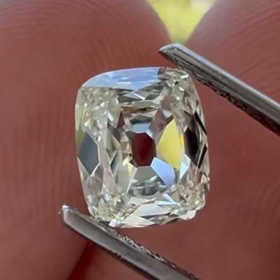 A 1ct GIA natural L color VS2 old cut cushion. Flatter profile with a bigger face-up look and lively reflections.