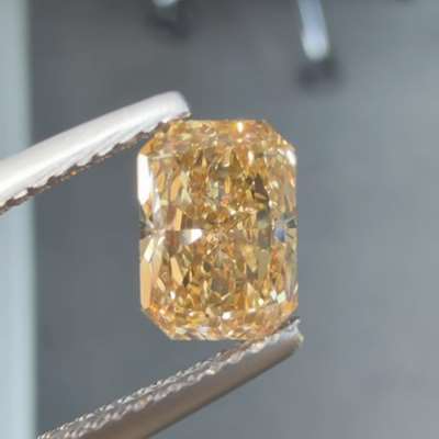 A 1.50ct Natural Fancy Orangy Brown nice elongated Radiant cut vs1 Clarity Diamond