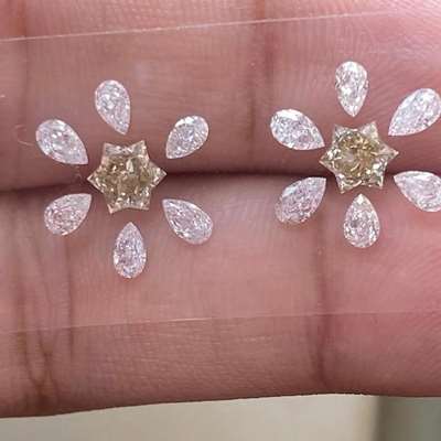  0.95ct total weight pair of champagne brown VS clarity star-shaped diamonds paired with 1.09cts total weight of twelve H color VS2 clarity pear-shaped diamonds