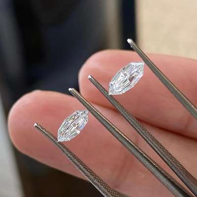 Two step cut each just 0.30ct marquise diamonds  One is D color,  an E — both VVS2 clarity and GIA certified.