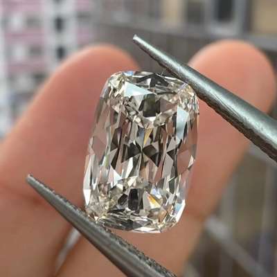 1.4 cts GIA as Natural, K faint brown, and VVS1 clarity, cushion diamond
