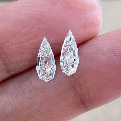 Two long pear step cut diamonds — one 0.50ct, the other 0.53ct — GIA certified, Natural G color, VS2 and VVS2 clarity