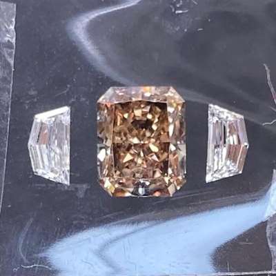  1.81ct natural copper brown radiant, VS2 clarity with  0.48ct pair of icy white Cadillac cuts, E color, VVS2 clarity 