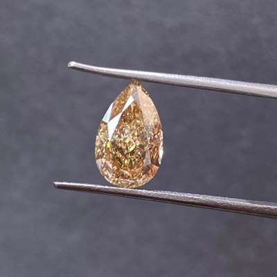  3.02 carats, The elongated pear shape , orangy-brown