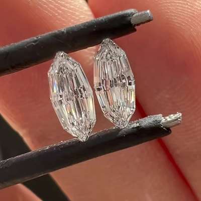 A super cute matching pair of GIA Certified D Color VVS1 Clarity 0.30ct & 0.30ct Step Cut Marquise Diamonds.