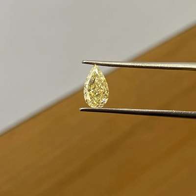 1.02cts Natural brownish yellow si2 clarity pear shape diamond. It has a nice hue of brown with a face up look being more yellowish