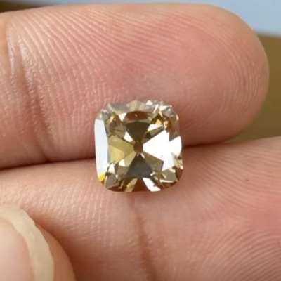 A 2ct IGI certified light brown old cut cushion, with SI1 clarity