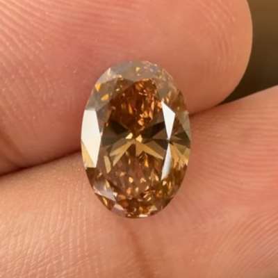 A 2.51cts natural orangy brown oval with VS1 clarity