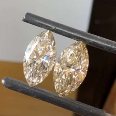 3.04cts total weight pair of natural U-V range, light brown VS1 clarity marquise shape diamonds