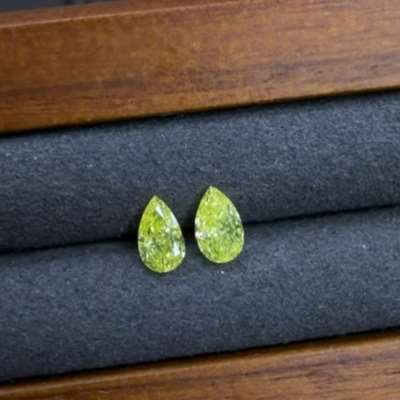 0.26ct and 0.27ct Matching pair of GIA Natural Fancy Intense Green-Yellow SI1 clarity Pear diamonds