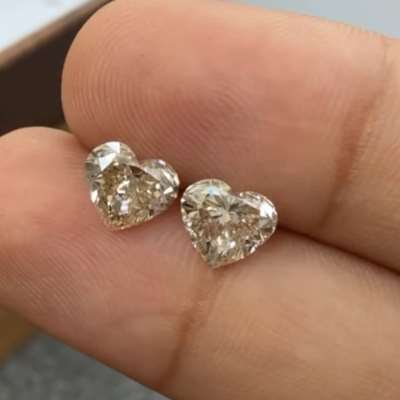 1.01ct & 1.01ct natural light brown SI1 heart shape pair