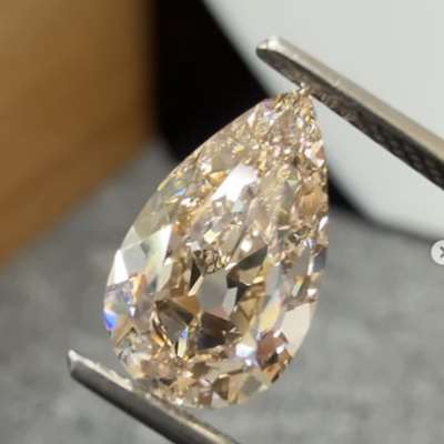  A beautiful 2.50cts natural peachy brown SI1 clarity old cut pear shape diamond