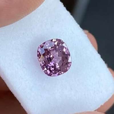 1.76ct cushion of liquid pink-purple sunset, glowing with its own inner fire. 